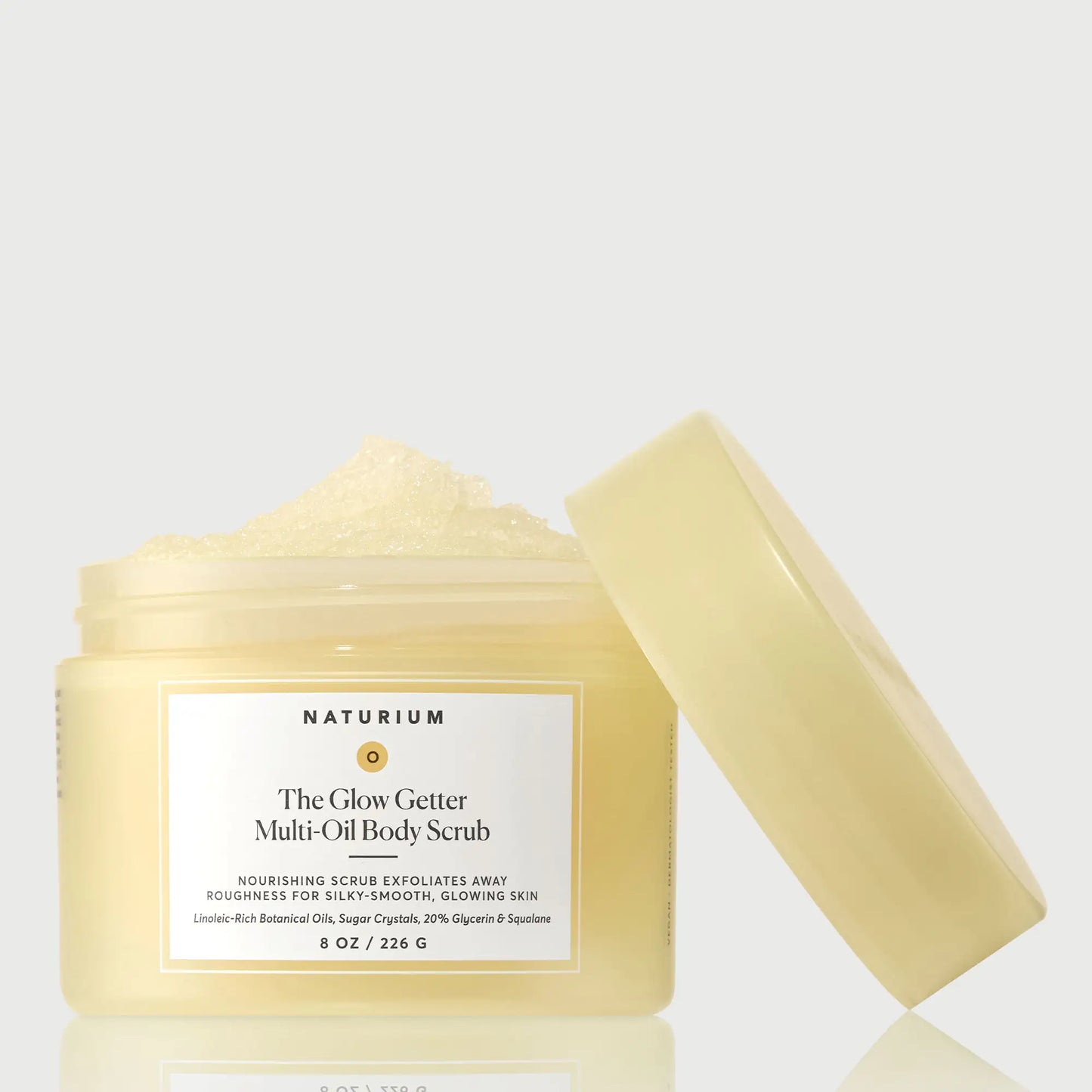 the-glow-getter-multi-oil-body-scrub-l7 NATR-40028-GlowGetter-Multi-Oil-Body-Scrub-Front-CapOff-bonebkgd.webp