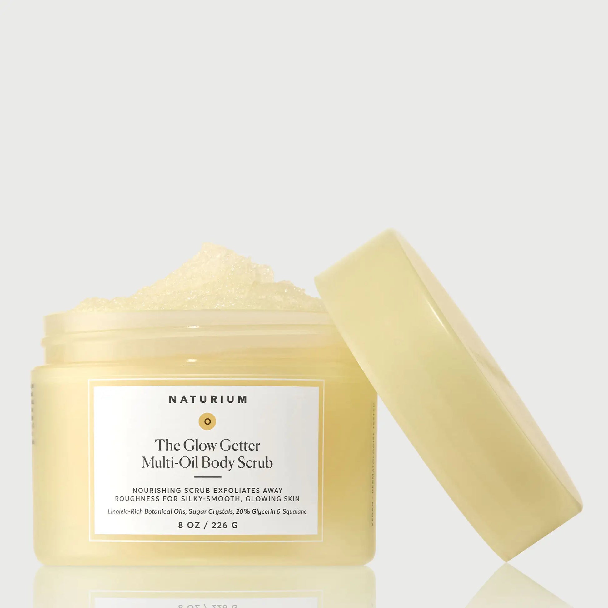 the-glow-getter-multi-oil-body-scrub-l7 NATR-40028-GlowGetter-Multi-Oil-Body-Scrub-Front-CapOff-bonebkgd.webp